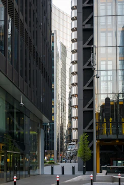 a couple of tall buildings sitting next to each other