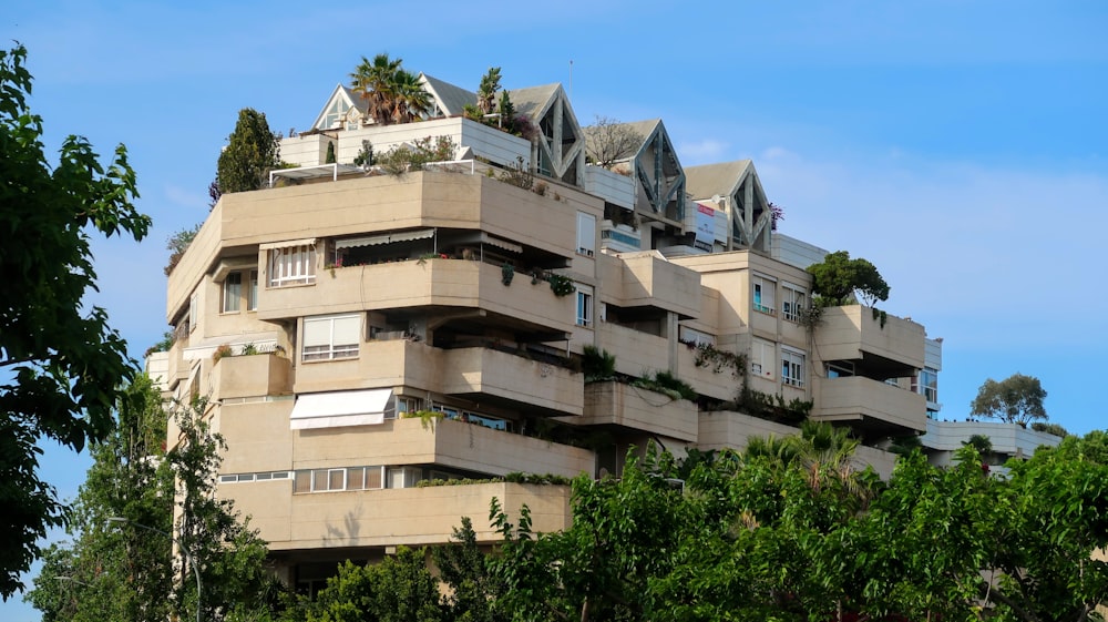 a very tall building with many balconies on top of it