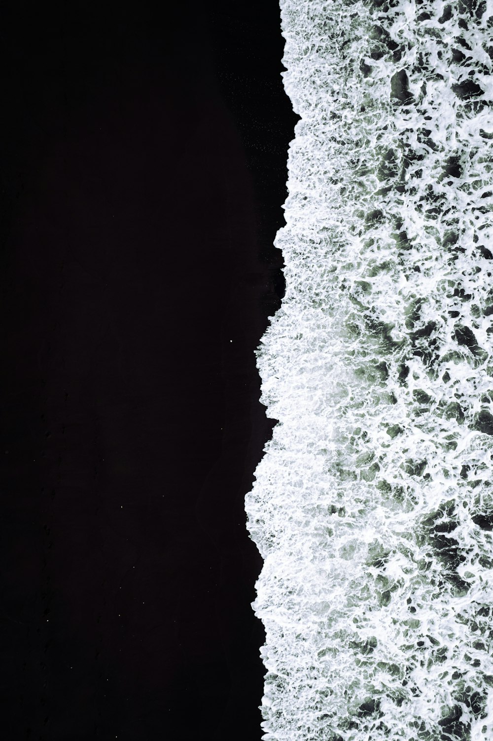 a person riding a surfboard on top of a wave