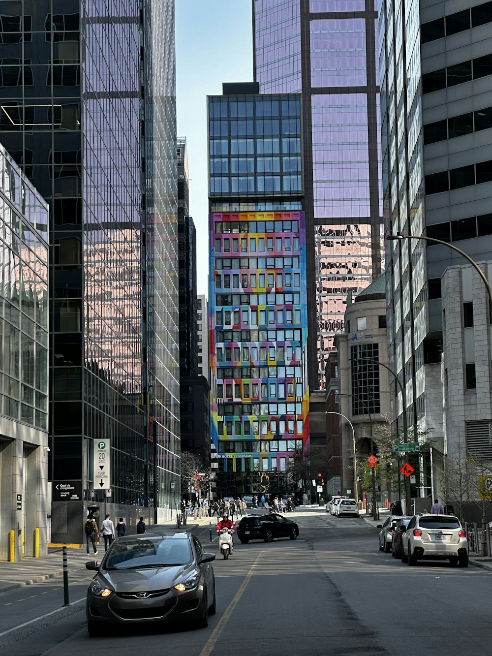 a city street filled with lots of tall buildings