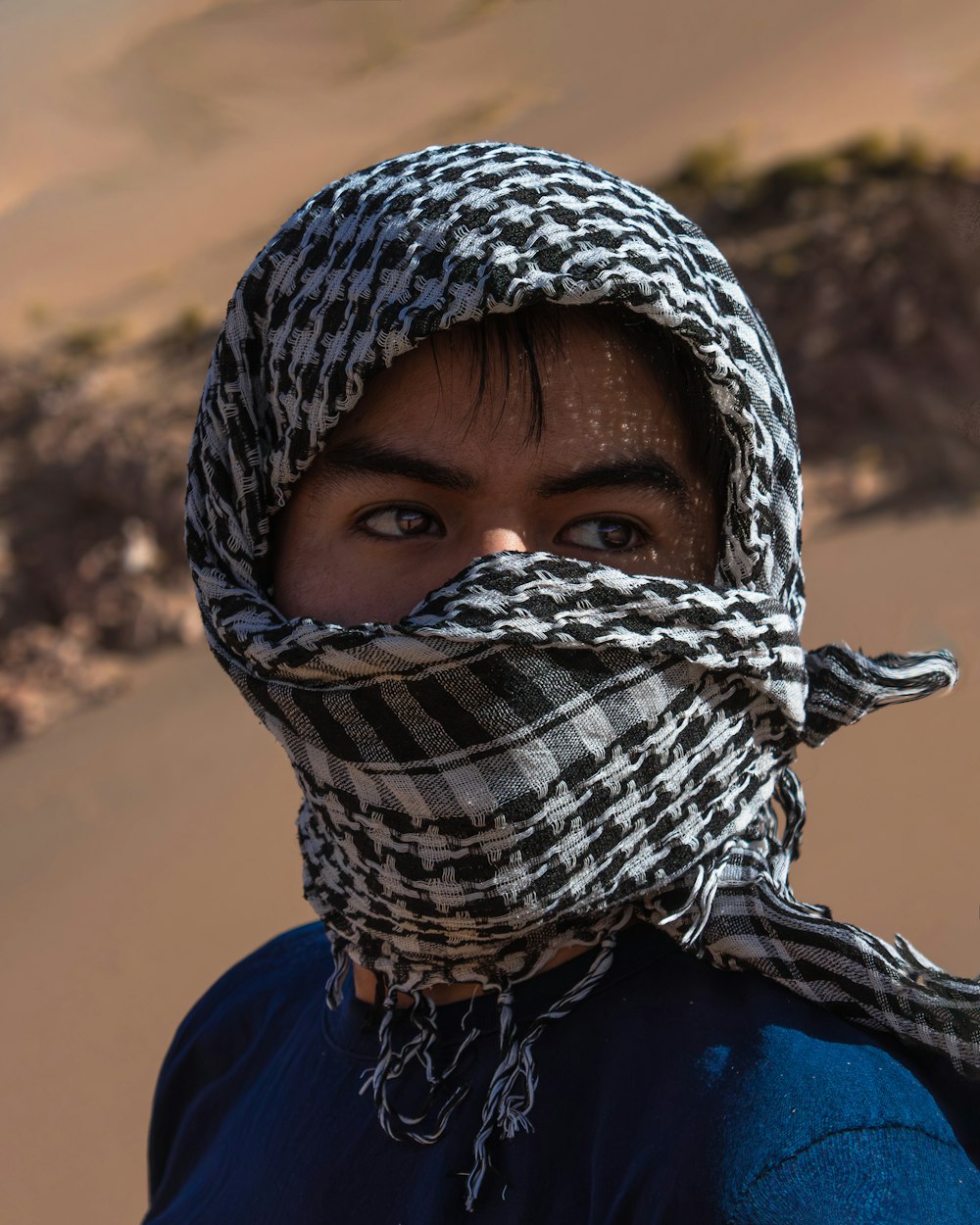 a woman with a scarf around her head