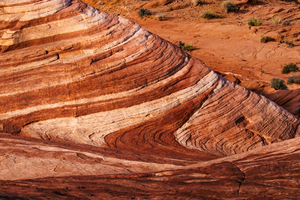 a large rock formation in the middle of a desert