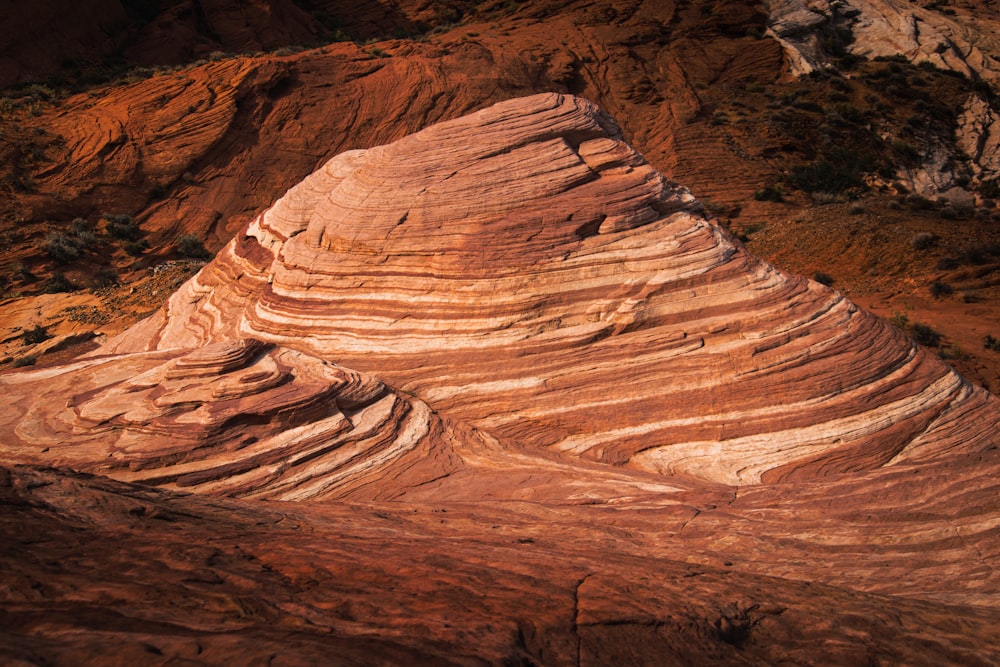 a large rock formation in the middle of a desert