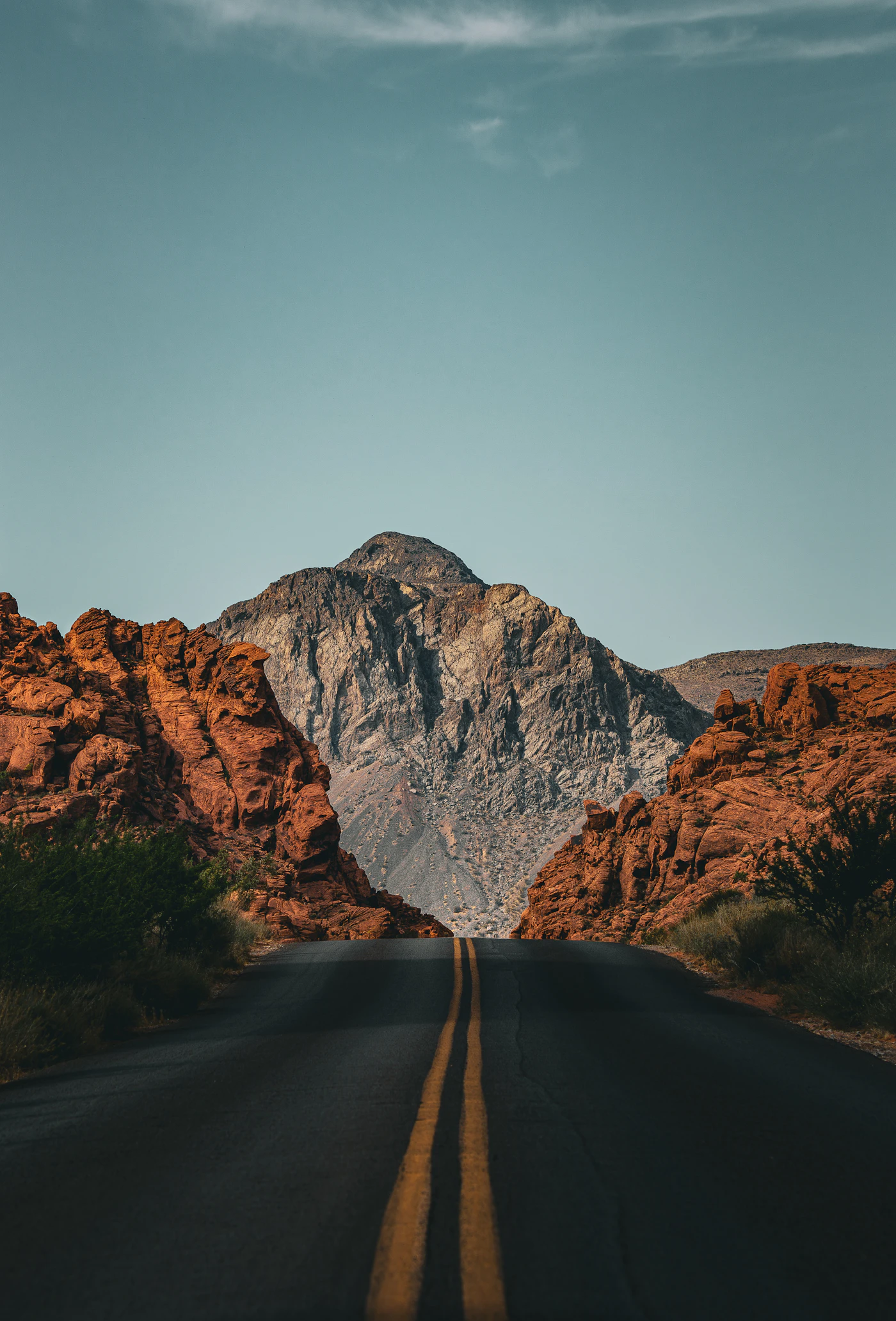 Red sandstone and a grey limestone peak at the edge of the Las Vegas valley