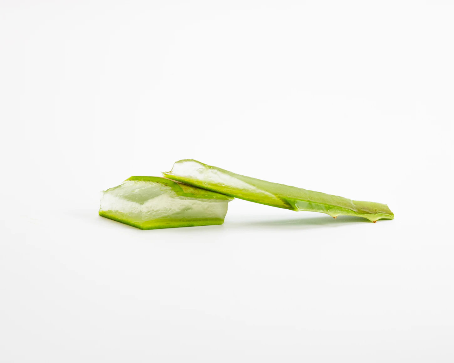 Fresh Aloe Vera gel being
    extracted from a mature leaf for skincare