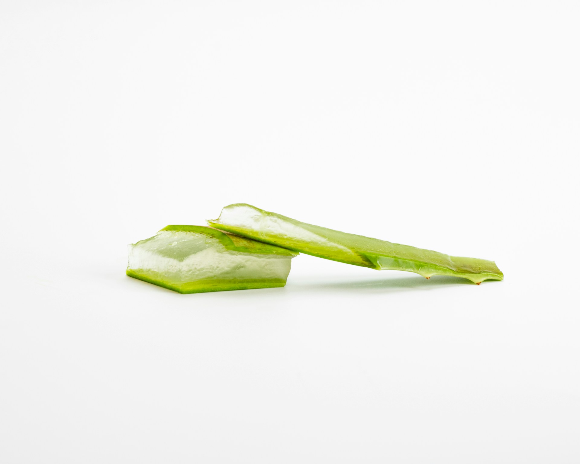 a piece of celery sitting on top of a white surface