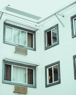 Detail of a gray anthracite window corner showing precise installation and smooth finishes