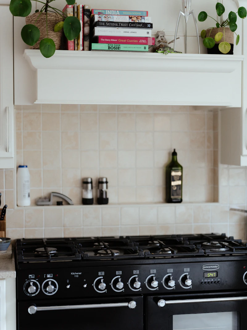 Black stove-top oven and range inside a kitchen