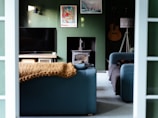 a living room filled with furniture and a flat screen tv