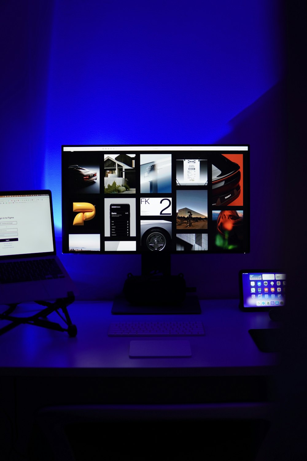 a desk with a laptop and a computer monitor