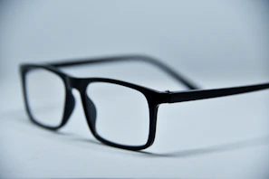 Bright red rectangular glasses showcased against a clean white background.