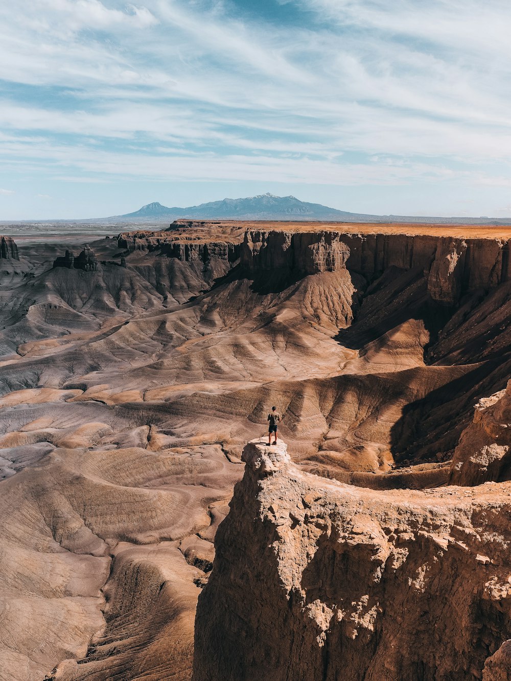 a person standing on top of a cliff