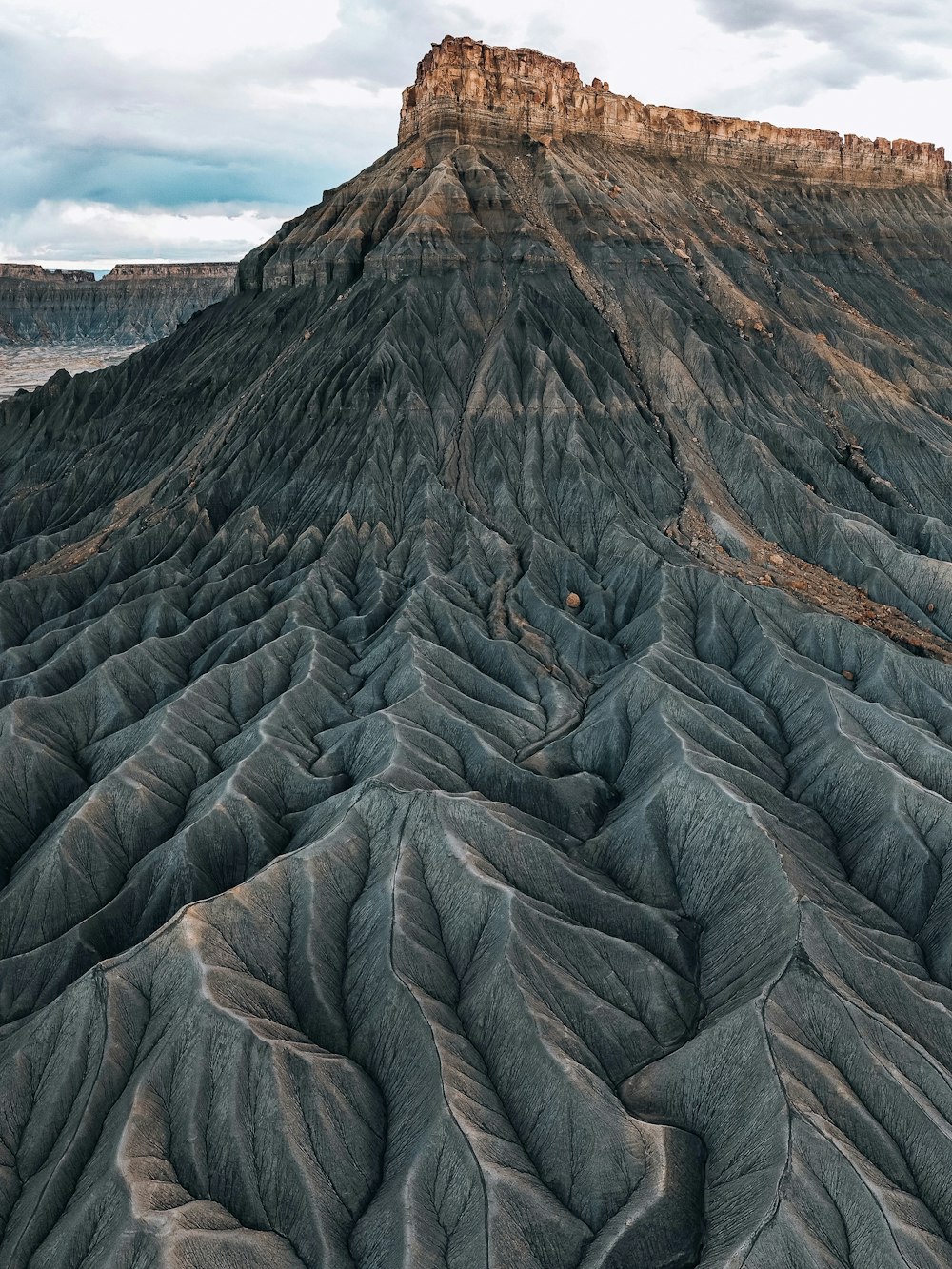 a very large mountain with a very tall mountain in the background