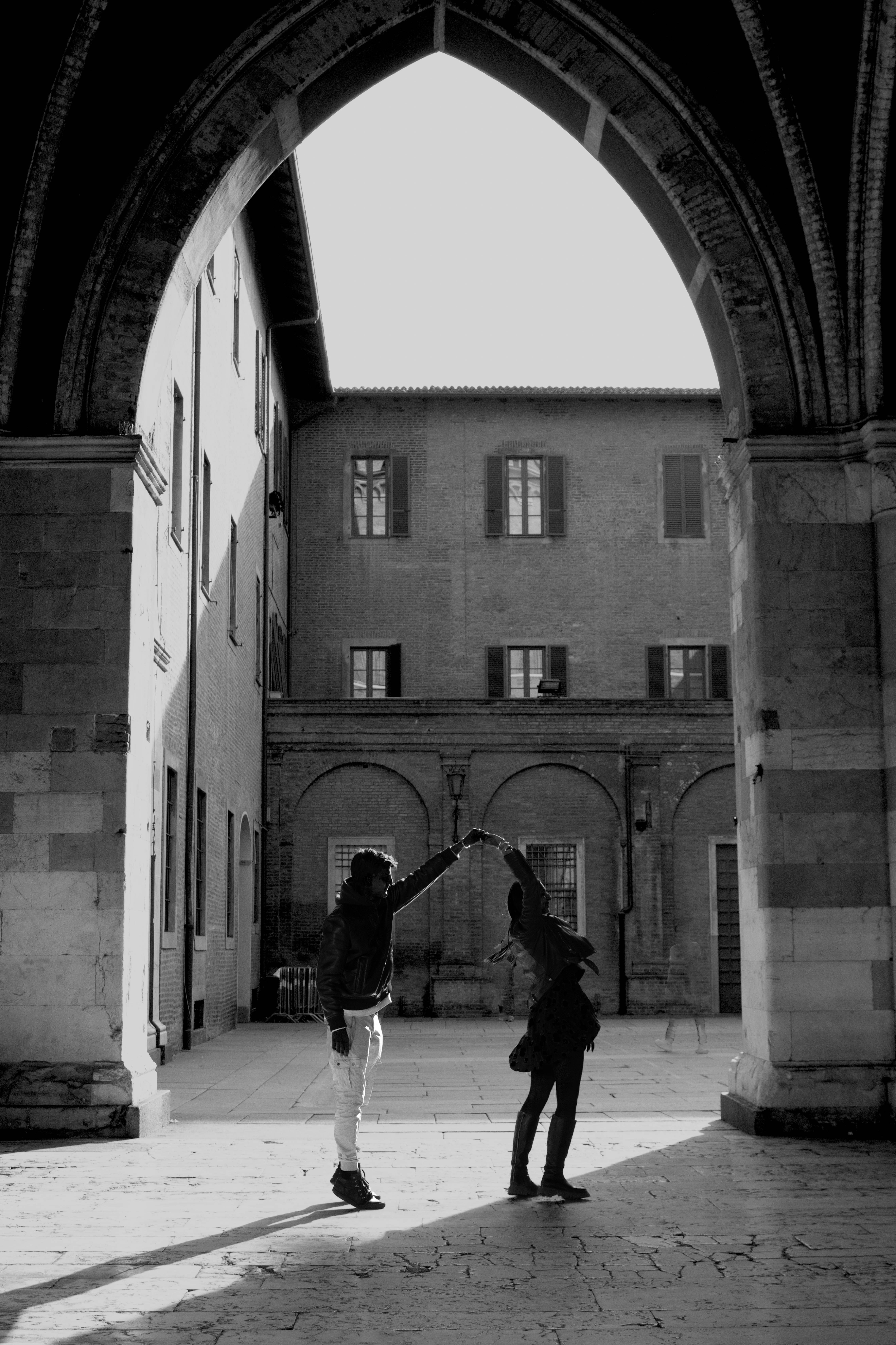 A couple of people that are standing in the street