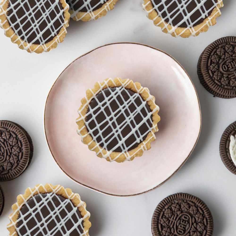 a plate of cookies with chocolate icing on it