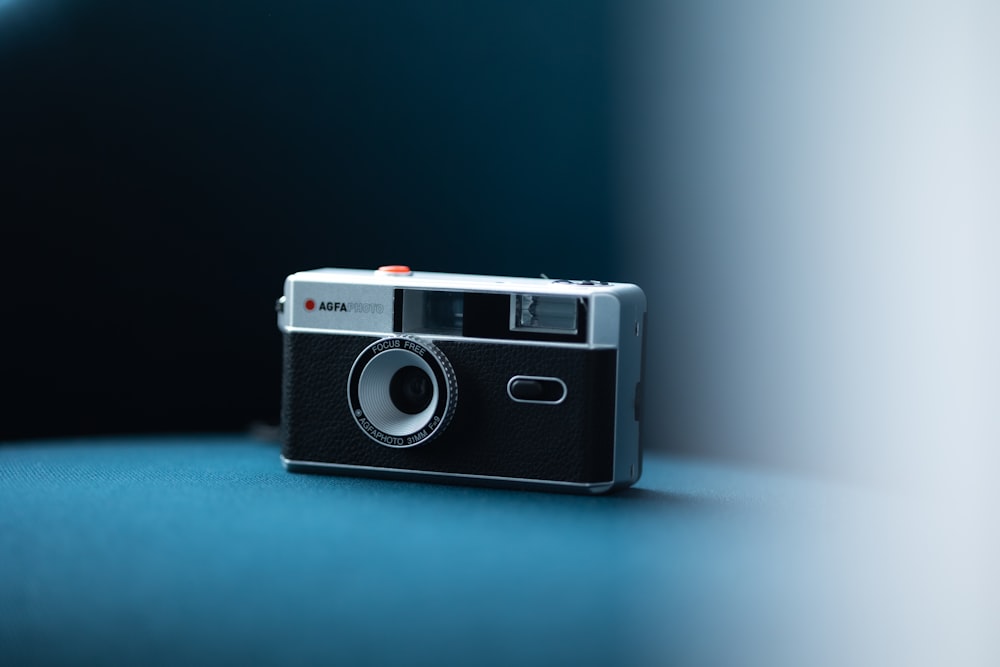 a camera sitting on top of a blue table