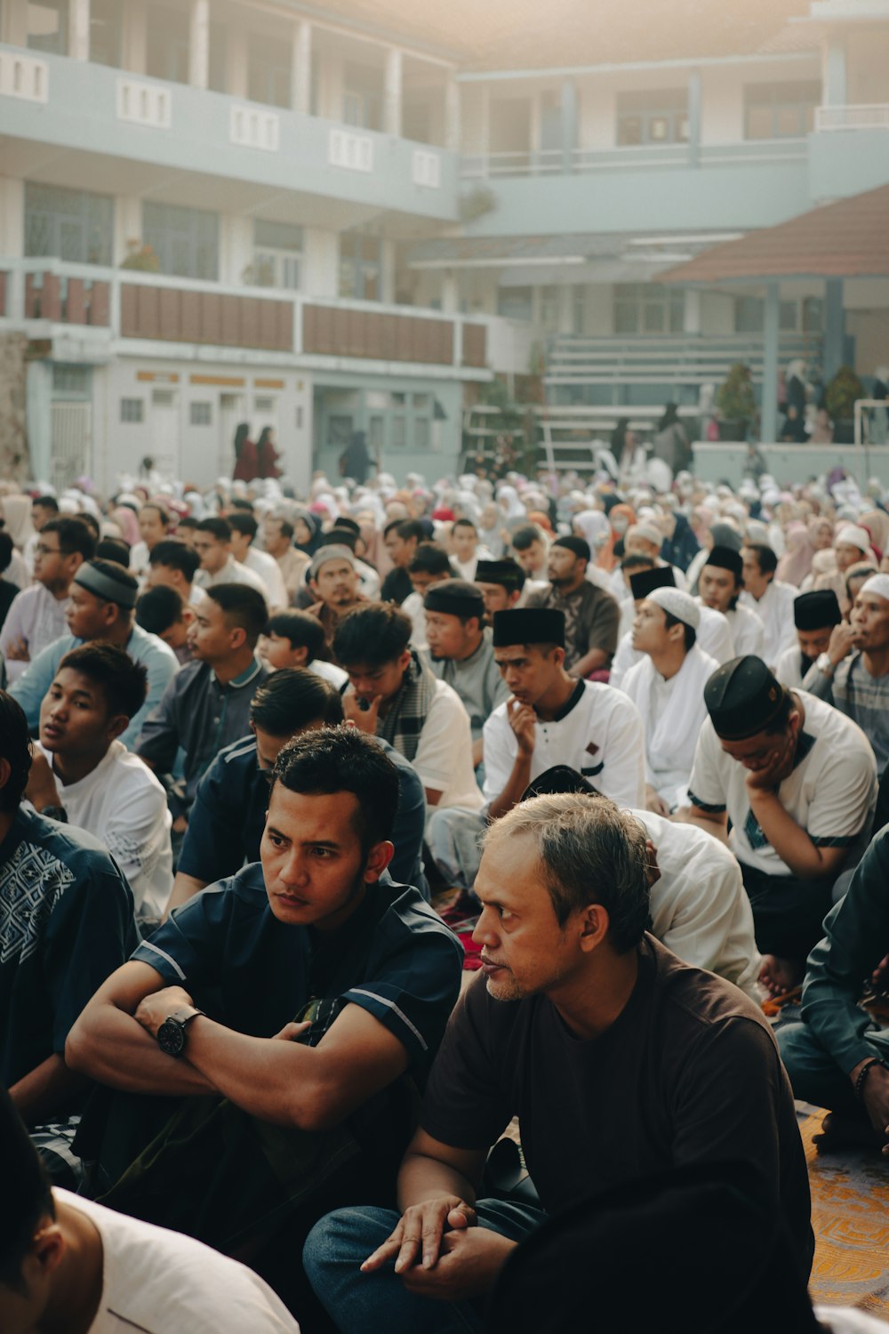 a large group of people sitting in a room