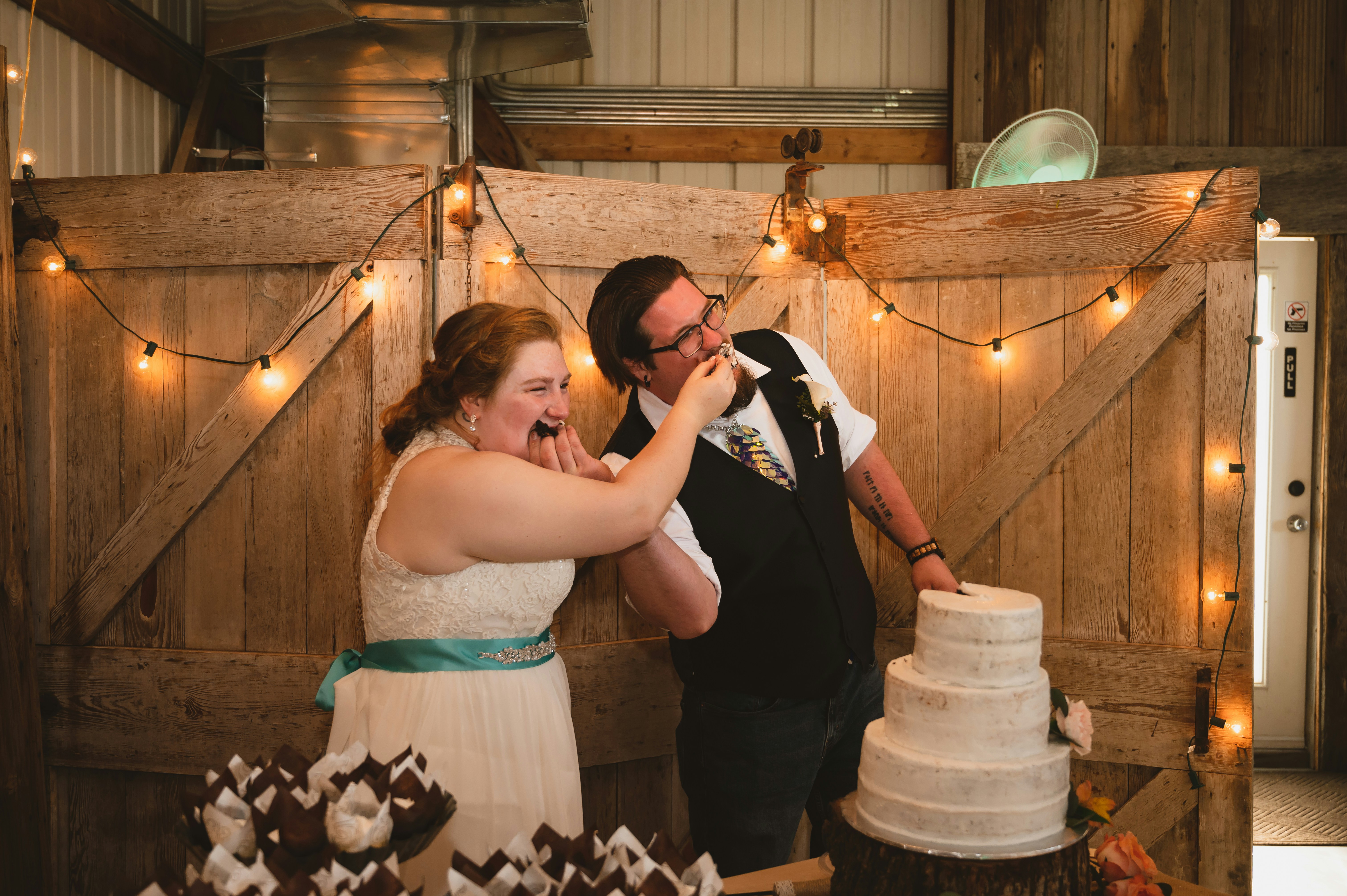 happy couple enjoying a dessert at their wedding - Dessert catering Dallas