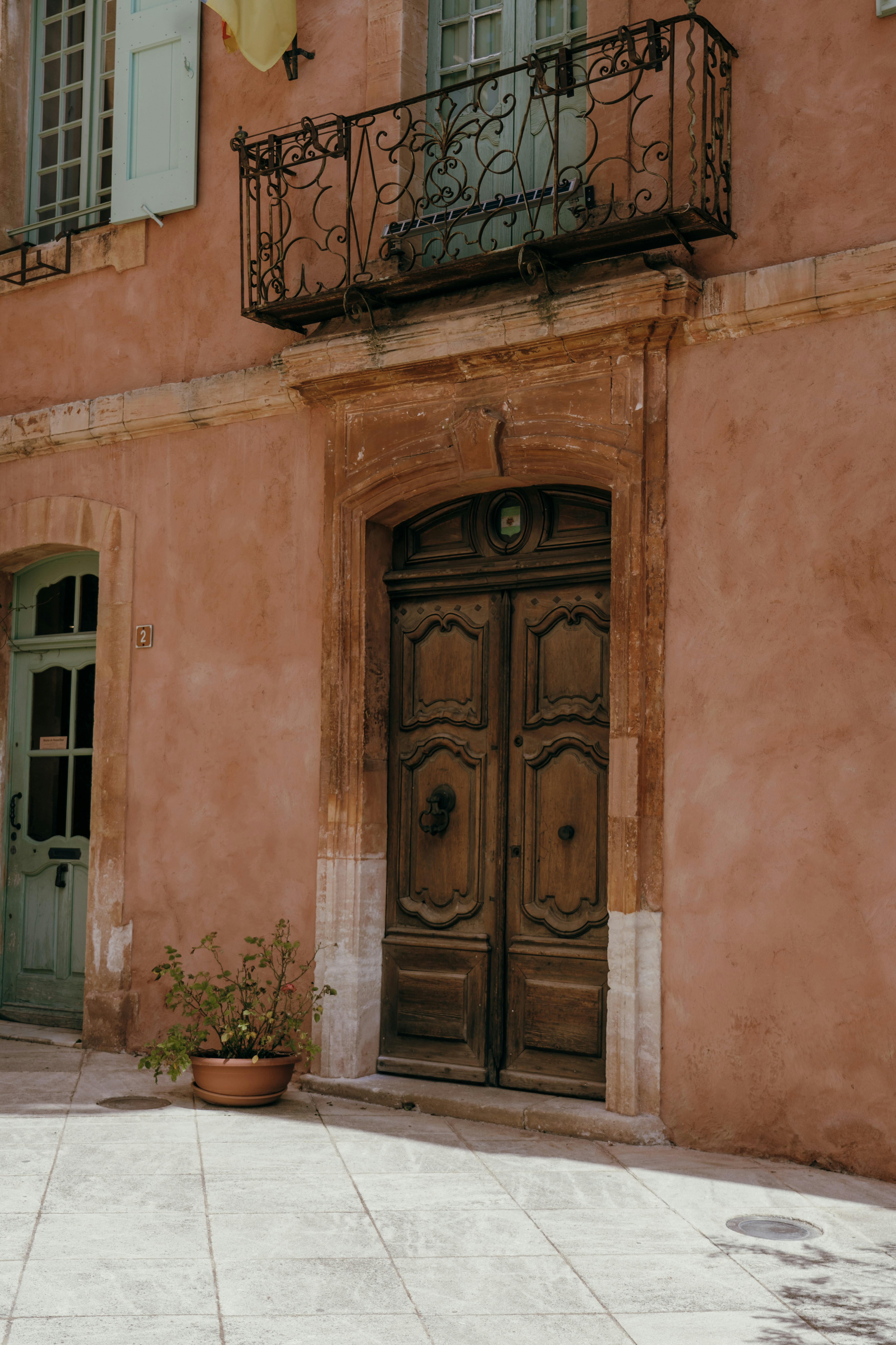 a building with two doors and a balcony