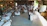 A warmly lit wedding reception with guests enjoying a rustic Texas BBQ buffet under amber string lights.