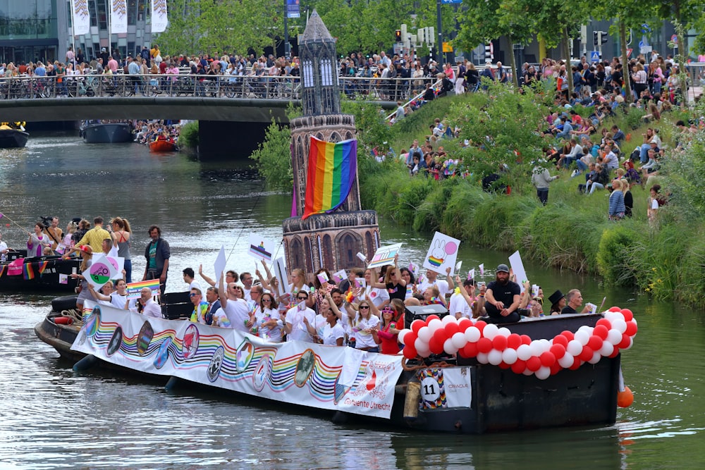 a group of people riding on the back of a boat