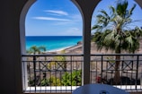 A beautiful view of a tropical beach from a hotel balcony.