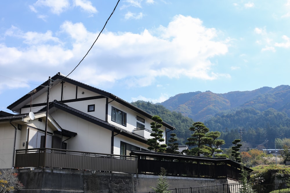 a house with mountains in the background