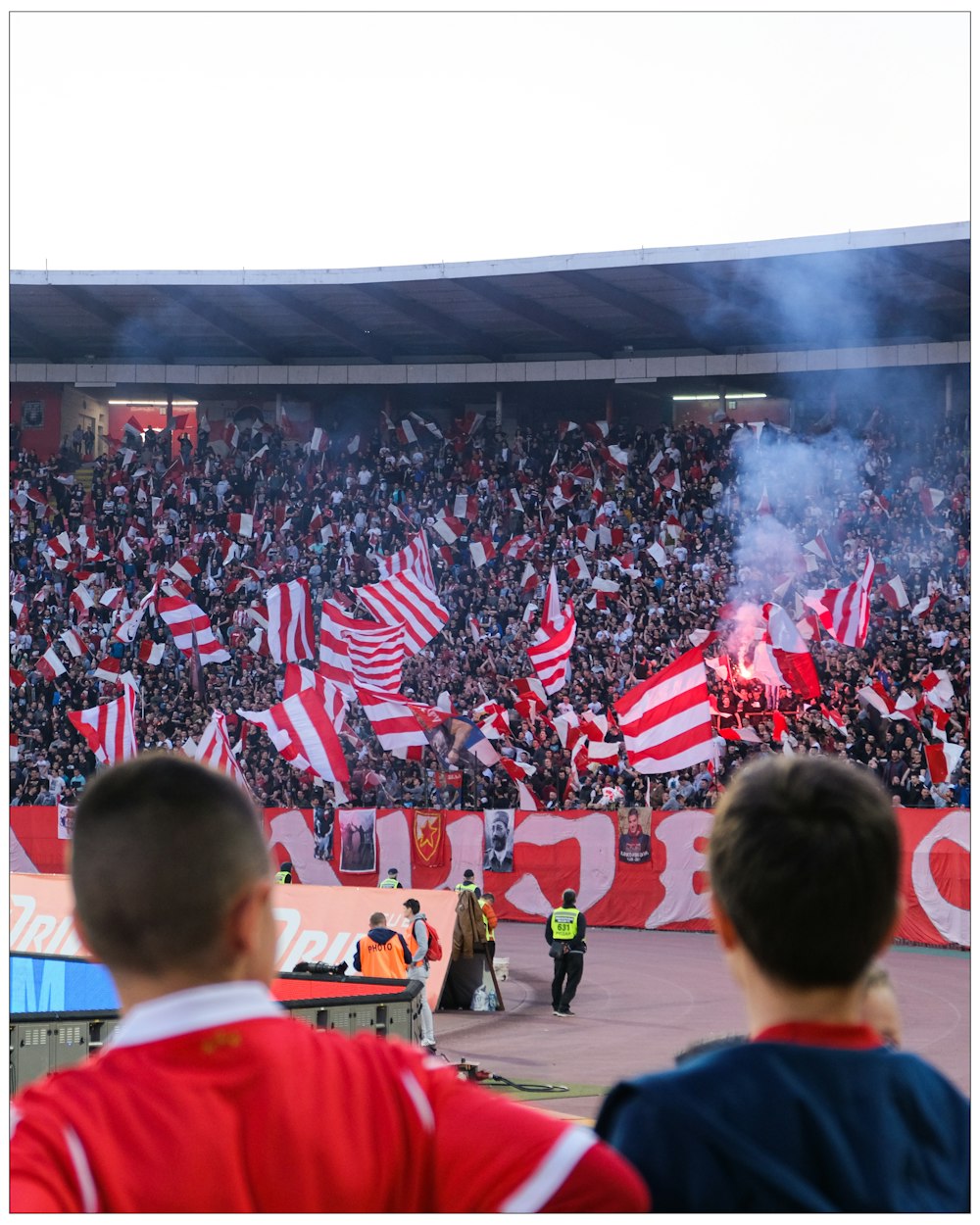 a crowd of people watching a soccer game