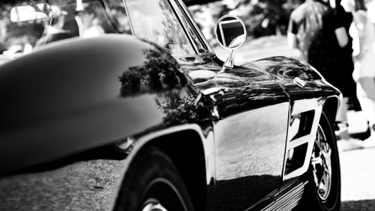 A gleaming car exterior polished to perfection under bright sunlight.