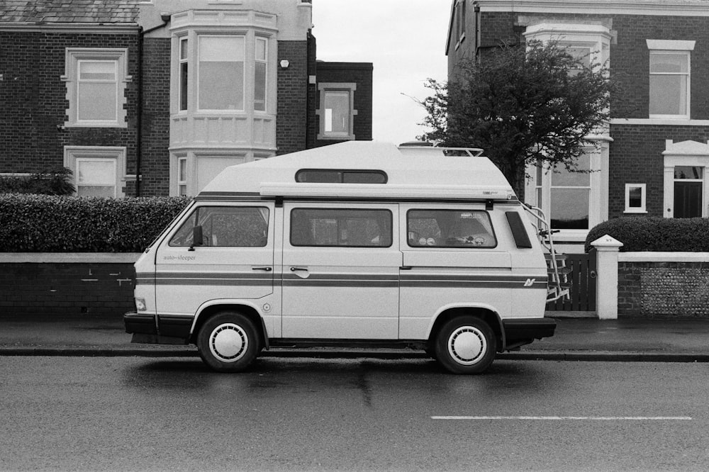 a white van parked on the side of a road