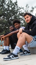 a group of young men sitting next to each other