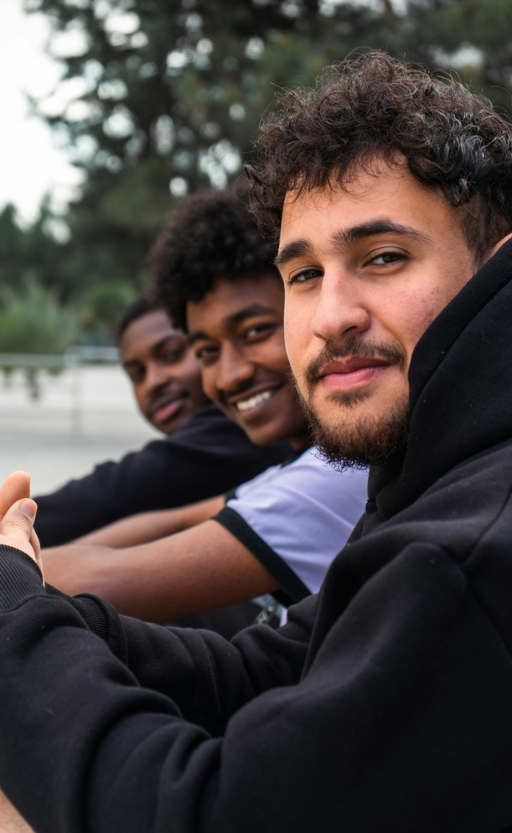 a group of young men sitting next to each other