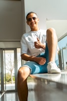 A happy customer giving a thumbs-up in a freshly cleaned living room.