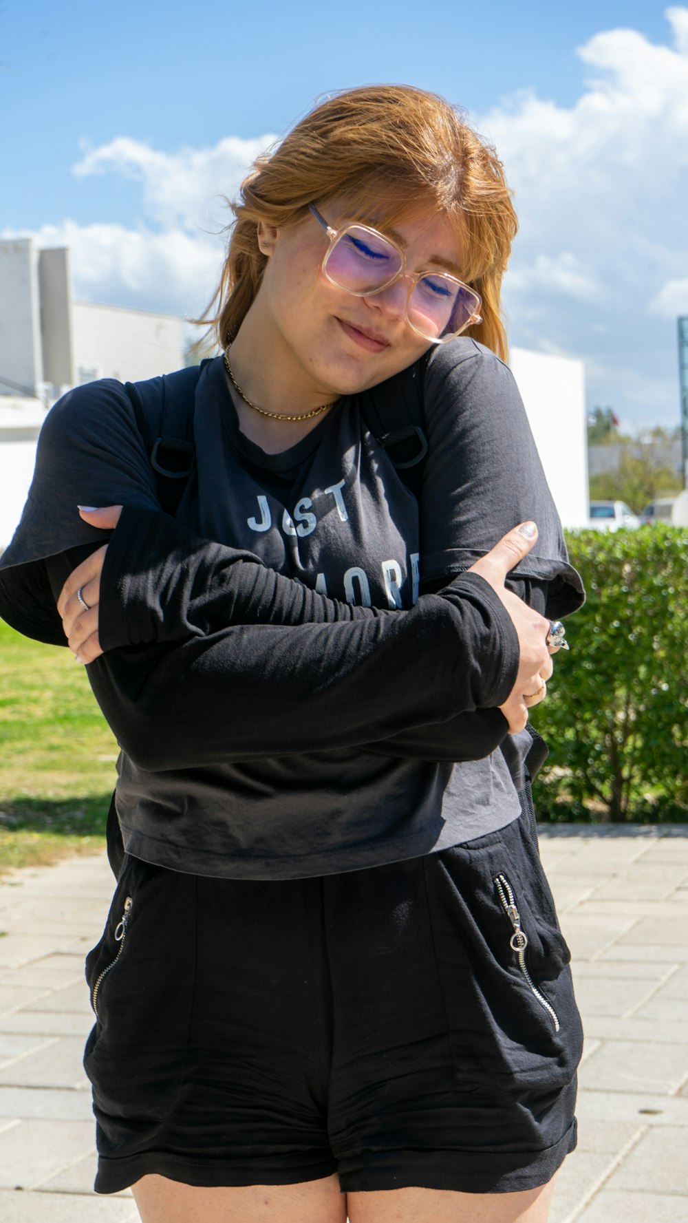 a woman in black shorts and a black shirt