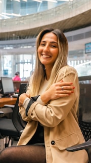 A smiling advisor sitting with a client, sharing personalized insurance solutions.