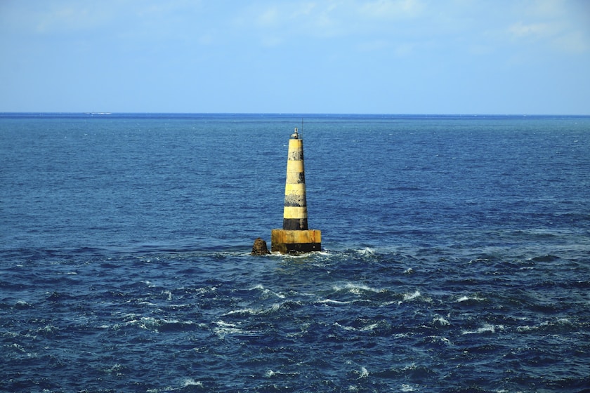 a light house in the middle of the ocean