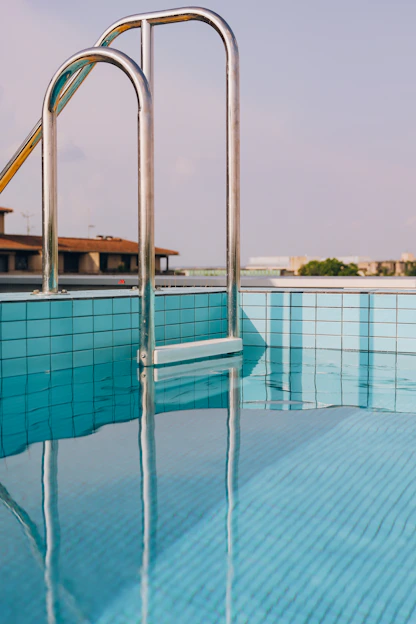a swimming pool with a slide next to it