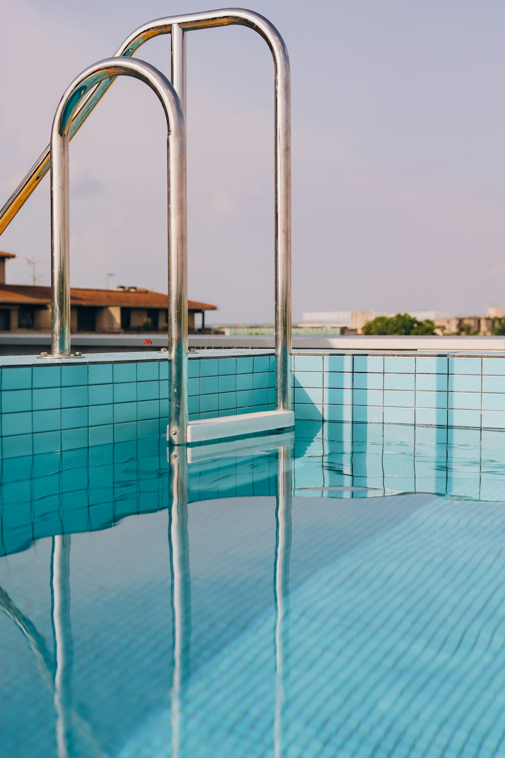 a swimming pool with a slide next to it