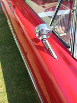 A close-up of a car's shiny exterior after detailing.