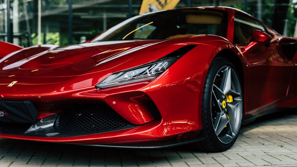 a red sports car parked in front of a building