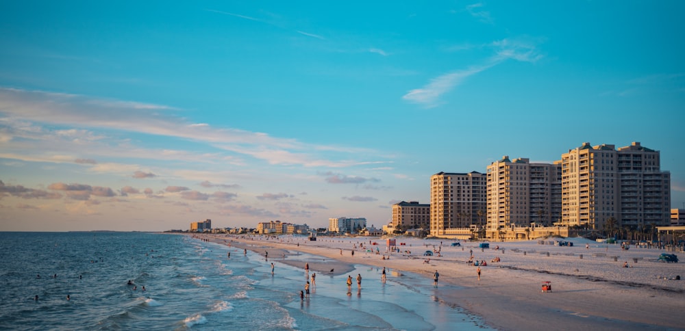 a view of a beach with buildings in the background