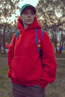 A vibrant shot of a Lumina Apparel hoodie layered casually for an active day in the city park.
