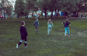 Children enjoying an outdoor game in a park.