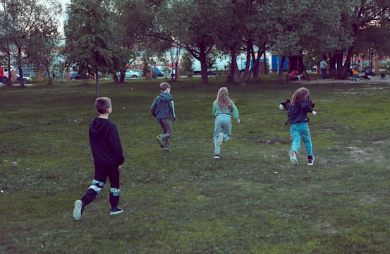Children playing happily in a safe community park.
