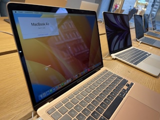 A variety of notebooks and desktops displayed neatly in a store.