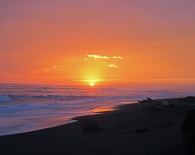 A beautiful sunset over the ocean captured in a postcard.