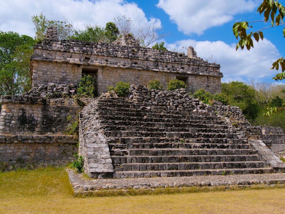 a stone structure with steps leading up to it