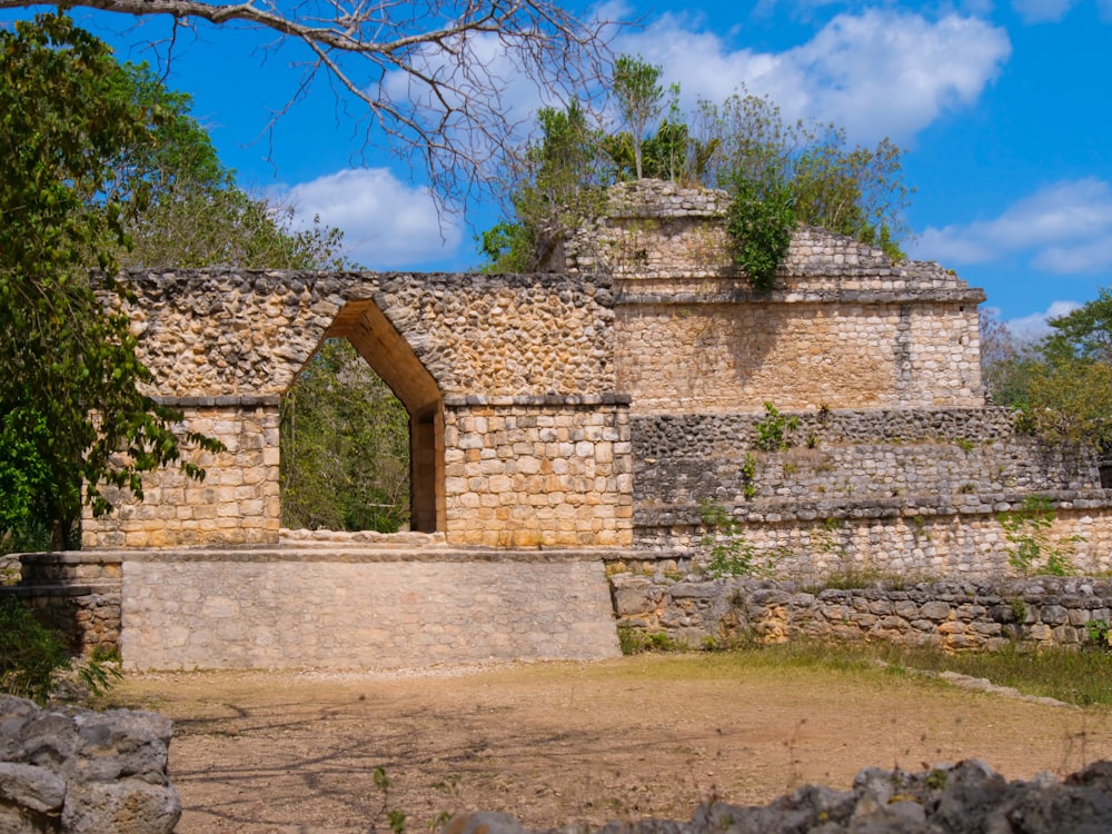 a stone building with a doorway and a window