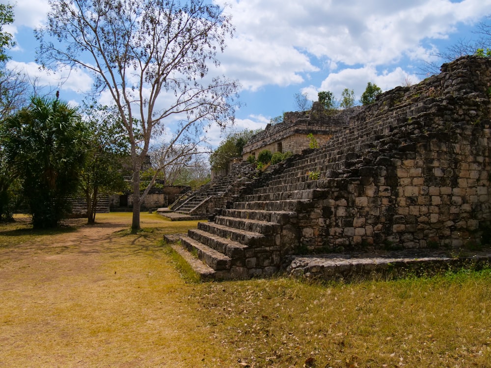 a stone structure with steps leading up to it