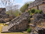 a stone structure with steps leading up to it